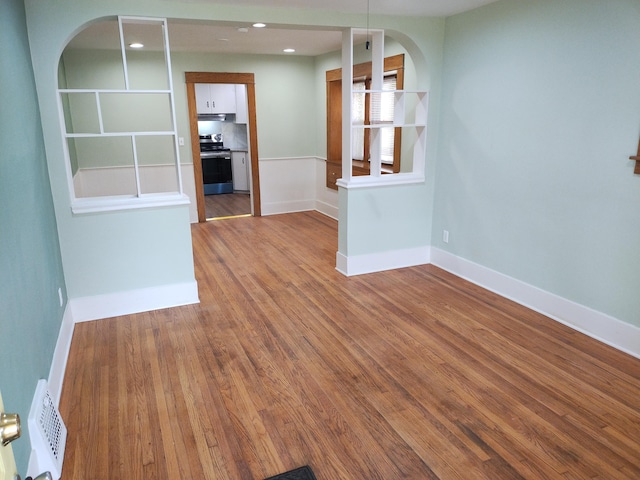 empty room with hardwood / wood-style floors