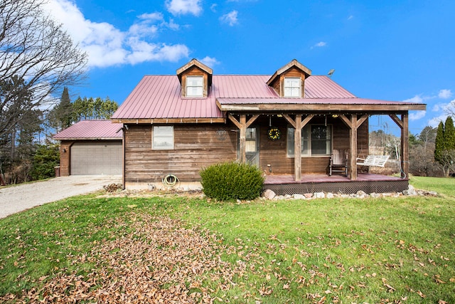 view of front facade with a porch, a garage, and a front yard