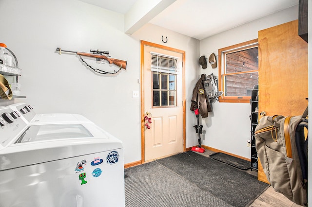 interior space featuring wood-type flooring and washing machine and clothes dryer