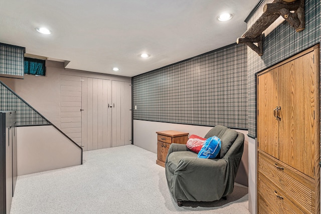 living area with light colored carpet