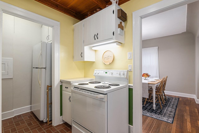 kitchen featuring white appliances, white cabinets, beam ceiling, dark hardwood / wood-style flooring, and wood ceiling