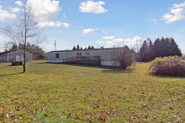 view of yard featuring a wooden deck