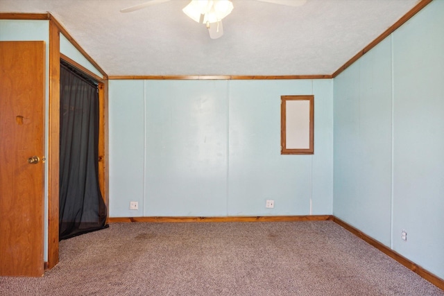 unfurnished room featuring light carpet, a textured ceiling, ceiling fan, and crown molding