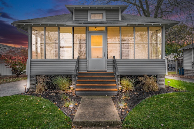 view of front facade featuring a sunroom