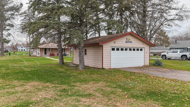 garage with a lawn