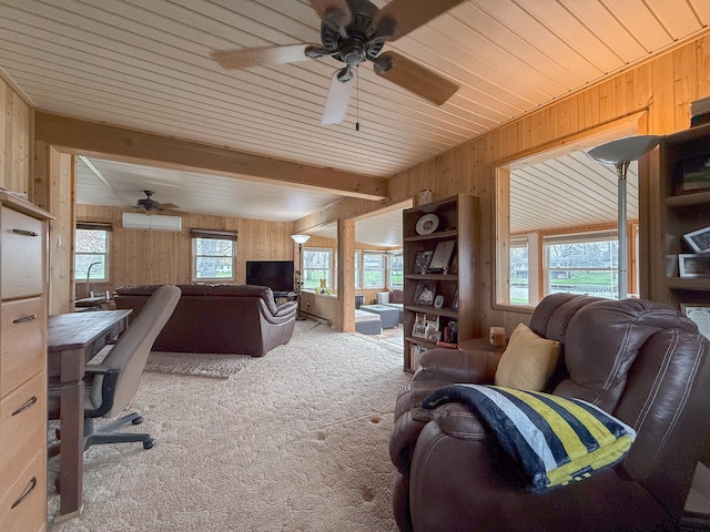 office area with light carpet, a wall unit AC, plenty of natural light, and wooden walls