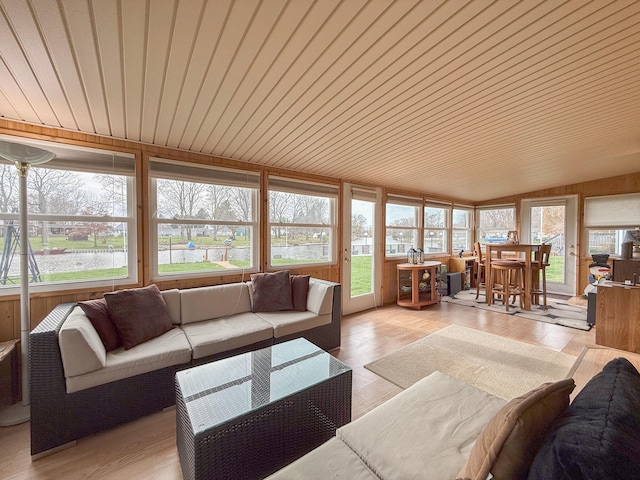 sunroom with lofted ceiling and wood ceiling