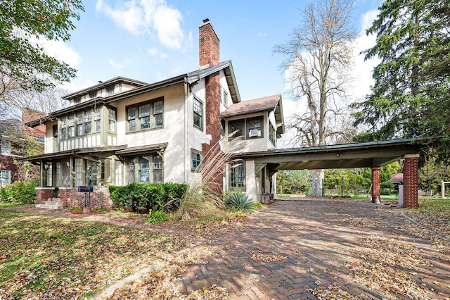 view of property exterior with a carport