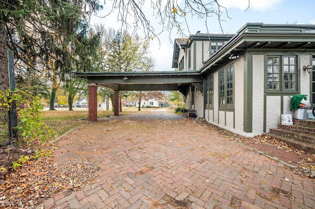 view of home's exterior with a carport