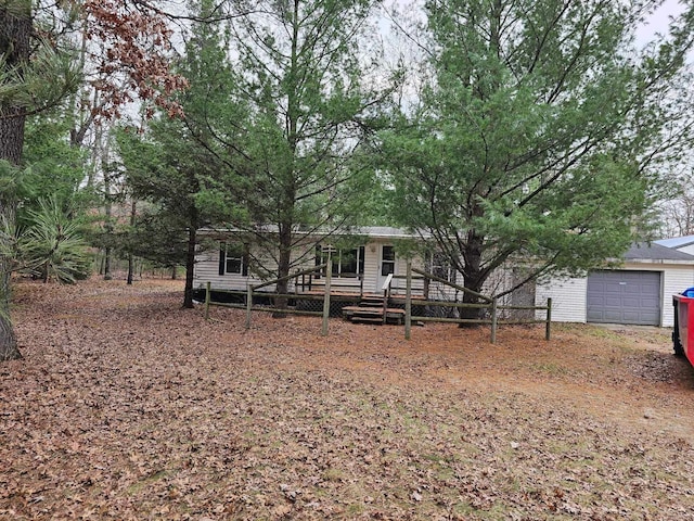 view of front of house with a garage and a wooden deck