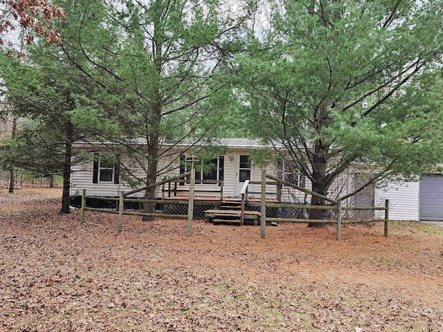 view of front of house with a garage and a wooden deck