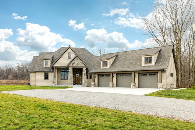 view of front facade with a garage and a front lawn