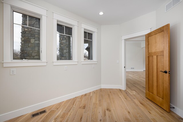 unfurnished room featuring light wood-type flooring