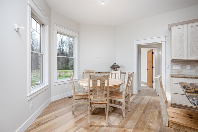 dining space featuring light wood-type flooring