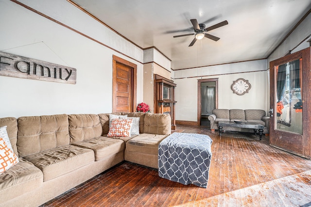 living room featuring dark hardwood / wood-style flooring and ceiling fan