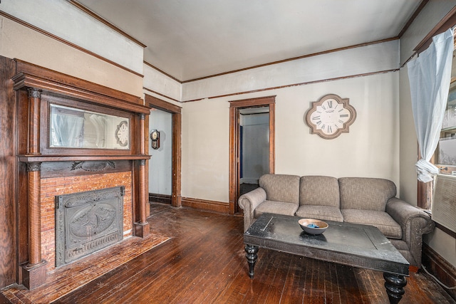 living room with dark hardwood / wood-style flooring and crown molding