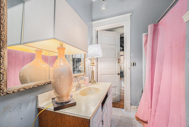 bathroom with vanity and tile patterned floors