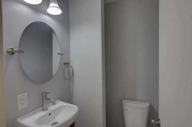 bathroom with sink and toilet