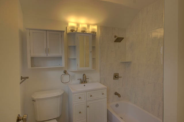 full bathroom with vanity, toilet, and tiled shower / bath combo