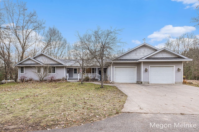 ranch-style house with a front lawn, a garage, and a porch