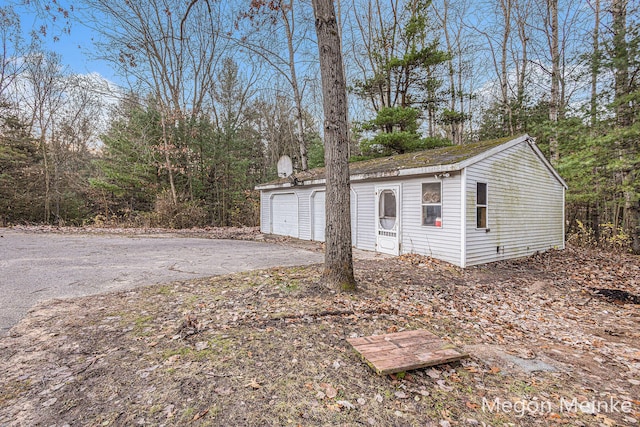 view of outbuilding featuring a garage