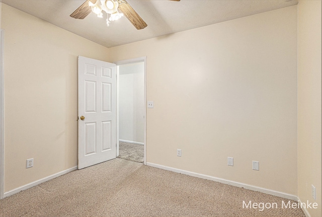 carpeted empty room with ceiling fan