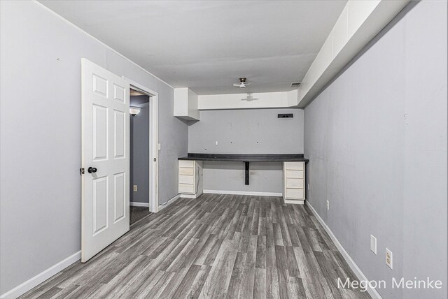 unfurnished living room featuring hardwood / wood-style flooring