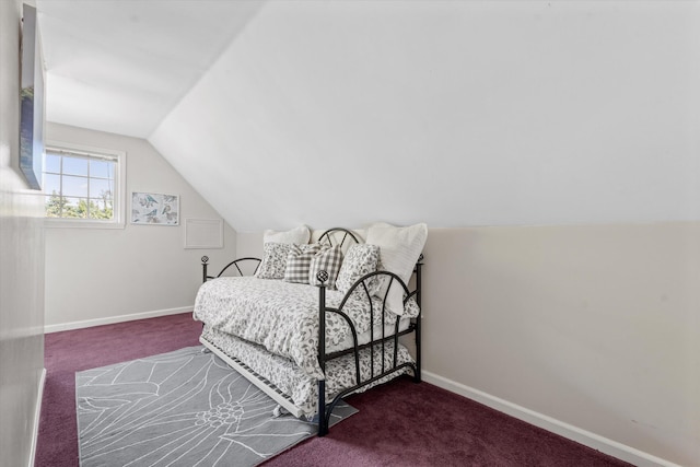 carpeted bedroom with vaulted ceiling