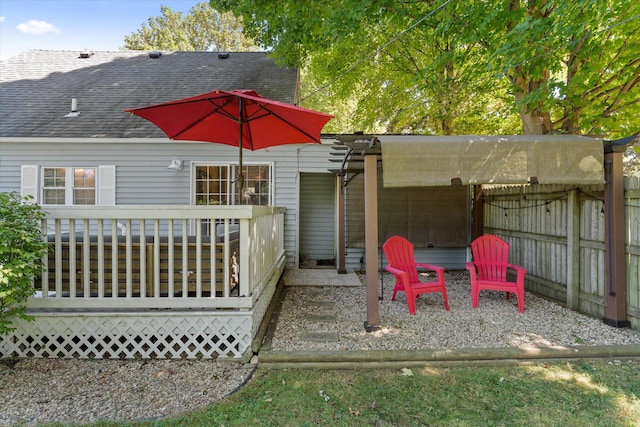 exterior space with a patio area and a wooden deck