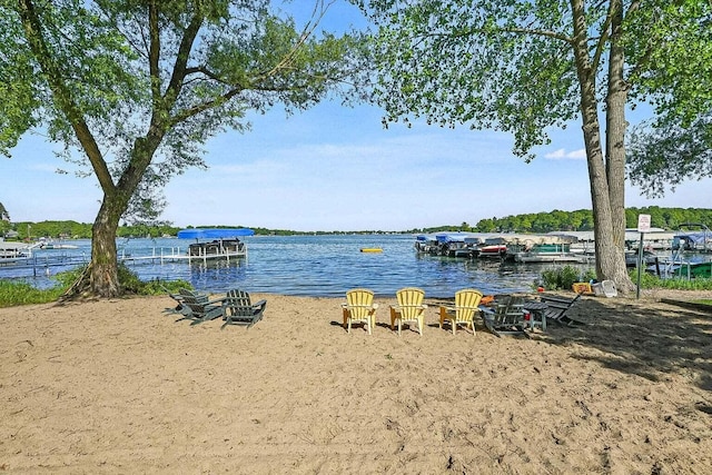 property view of water with a dock