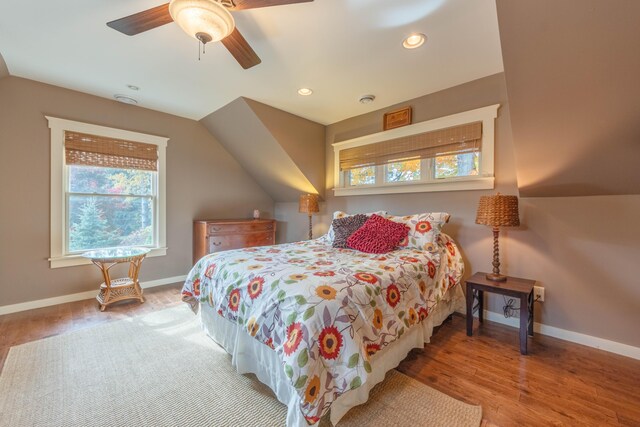 bedroom with ceiling fan and hardwood / wood-style flooring