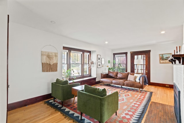 living room with light hardwood / wood-style flooring