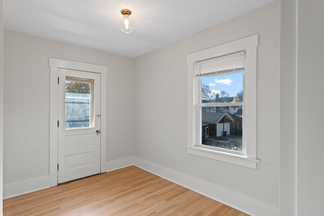 doorway with light hardwood / wood-style flooring