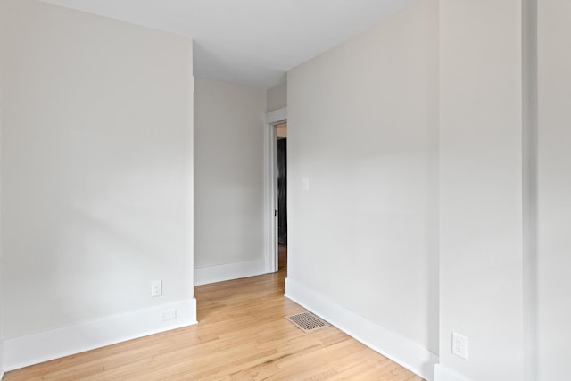 unfurnished room with light wood-type flooring