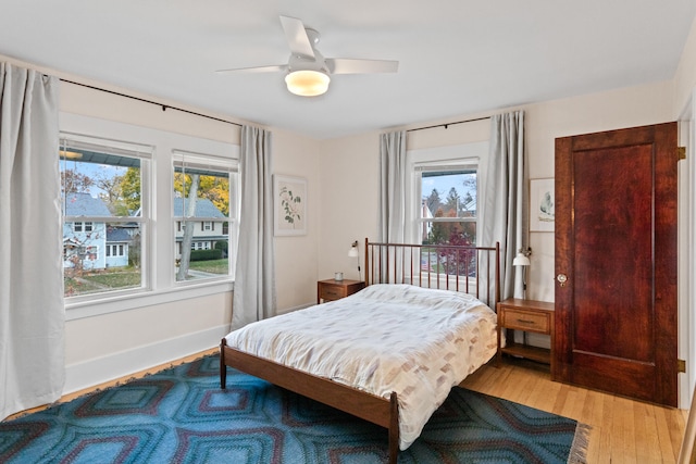 bedroom featuring light wood-type flooring and ceiling fan