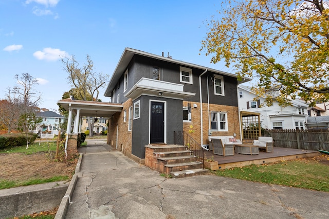 back of property featuring an outdoor hangout area