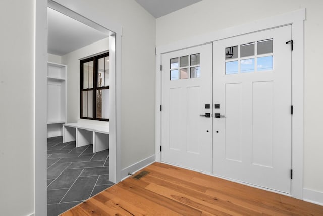 foyer entrance featuring dark hardwood / wood-style flooring