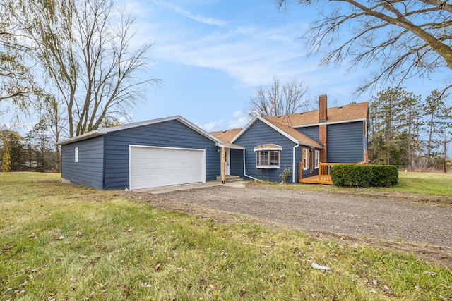 view of front of house featuring a deck, a garage, roof with shingles, a chimney, and a front yard