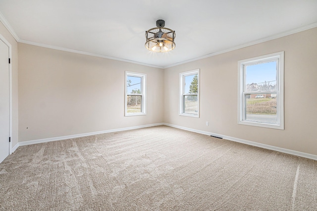 carpeted empty room featuring ornamental molding