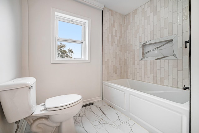 full bath with marble finish floor,  shower combination, toilet, and baseboards