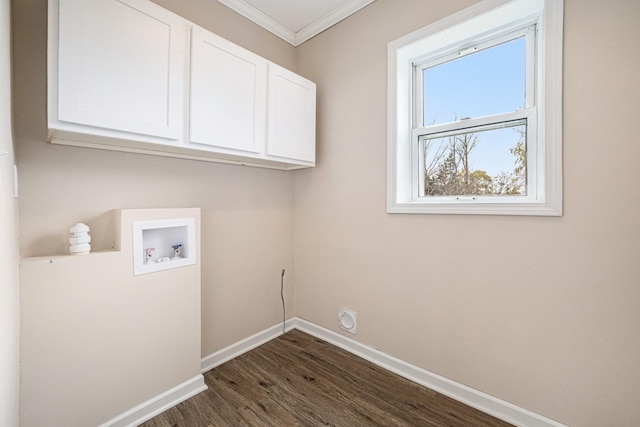 washroom featuring cabinet space, baseboards, ornamental molding, dark wood-type flooring, and hookup for a washing machine