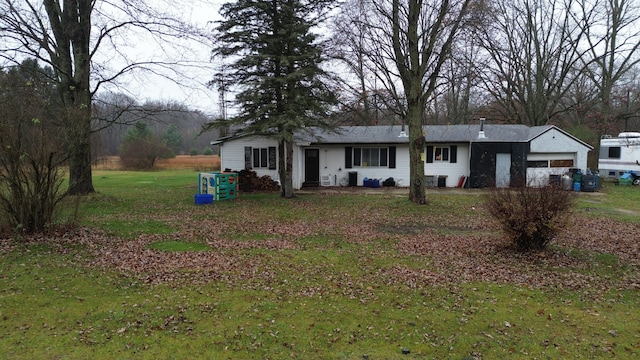 ranch-style home featuring a front yard