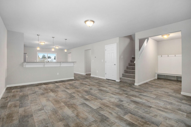 unfurnished living room with wood-type flooring