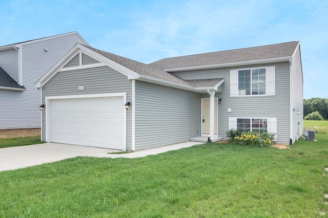 view of front facade with a front lawn, central AC unit, and a garage