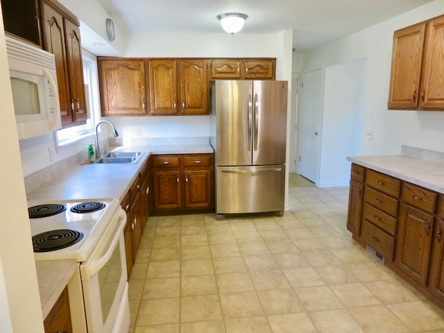 kitchen with sink and white appliances