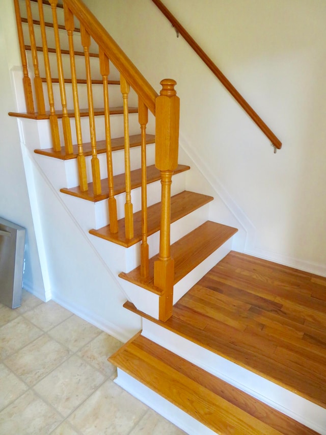 stairs with tile patterned flooring