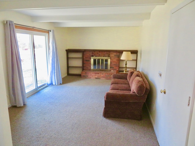 living room with a brick fireplace, light carpet, and beam ceiling