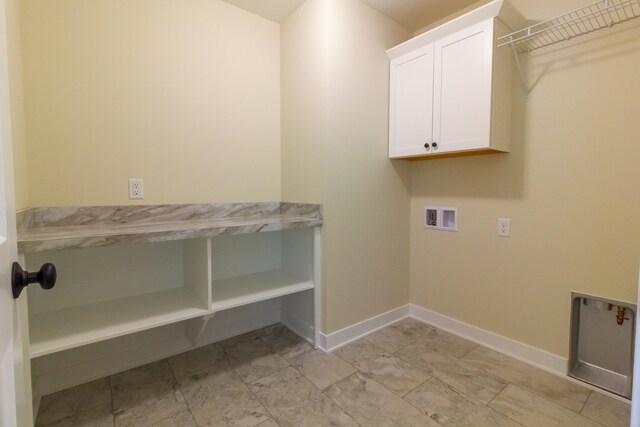 laundry area with cabinets and washer hookup