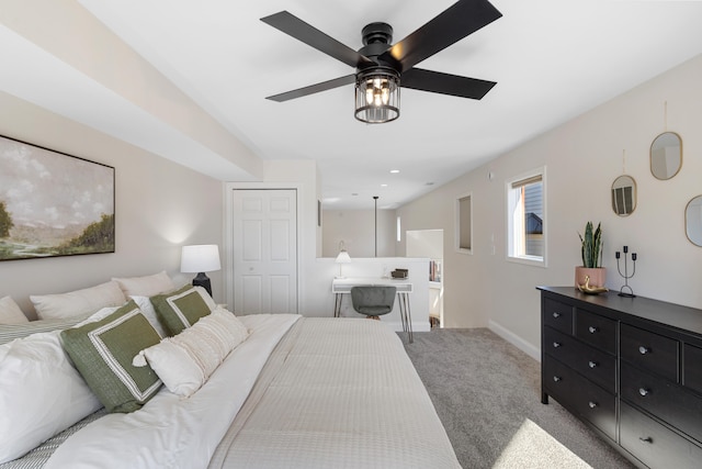 carpeted bedroom featuring ceiling fan and a closet