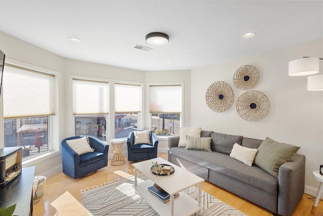 living room with light hardwood / wood-style flooring